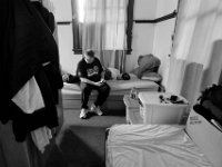 Joe Cosby, marines, sits on his bunk as he receives a text message from his brother informing him that he has been diagnosed with leukemia.  Joe is one of the residetns of the Veterans Transition House currently housed at the rectory of the now closed St. John church on County Street in New Bedford, MA. A new building is scheduled to be constructed in 2019.   PHOTO PETER PEREIRA